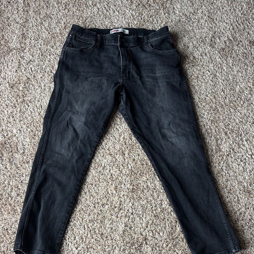 Men’s black wrangler jeans, slightly distressed.  Regular taper, 36 x 29